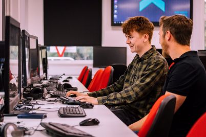 A-Computing-student-being-supported-by-their-tutor-at-University-of-Gloucestershire-scaled.jpg